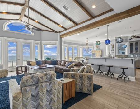 Living area and kitchen looking out at the ocean