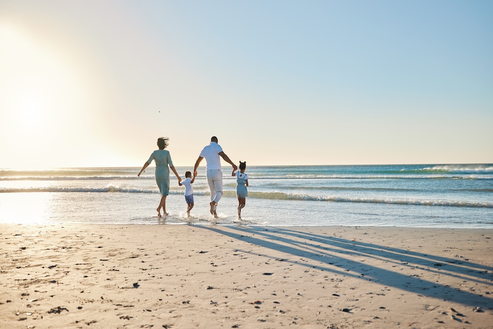 Family walking on beach